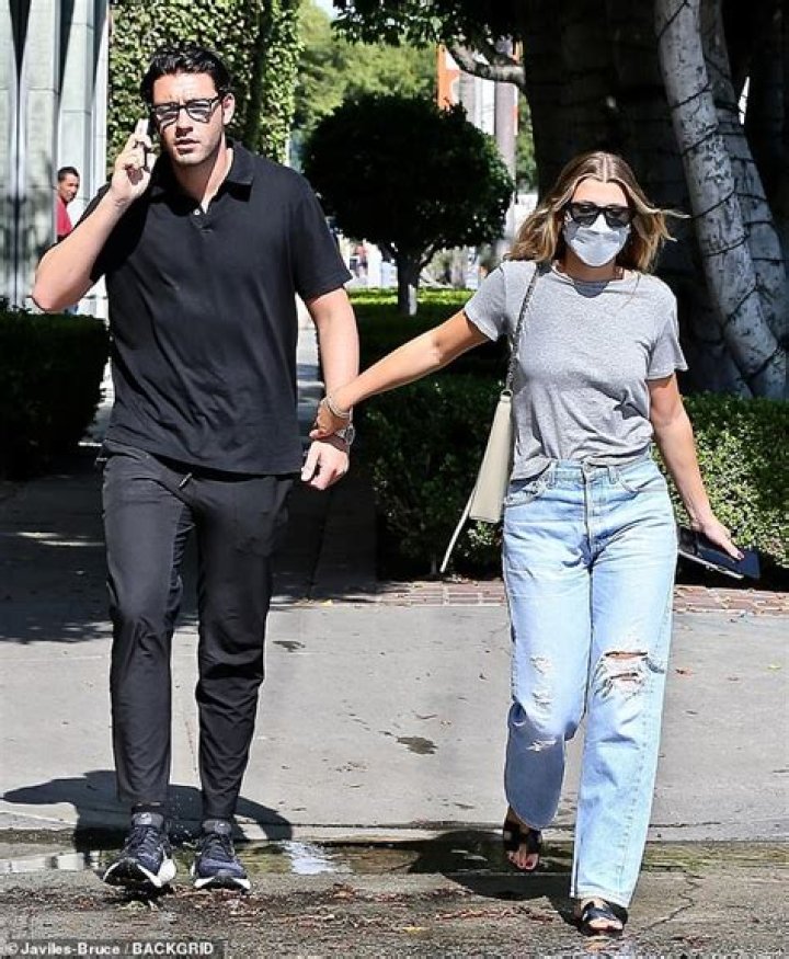 Sofia Richie affectionately grabs boyfriend Elliot Grainge's hand while